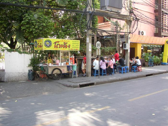 Thai People Eating Lunch At A Street Vendor's Food Cart