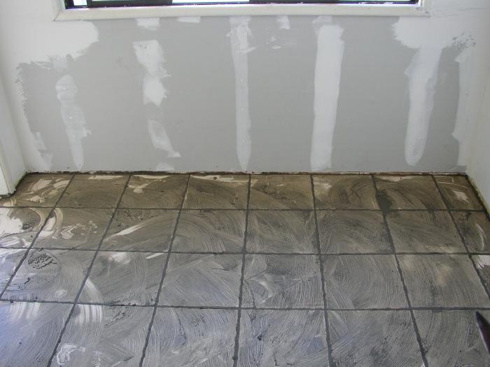 The Tile Is In Place And The Grout Is Spread On It